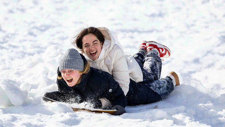 Various photos of students playing in the snow on campus